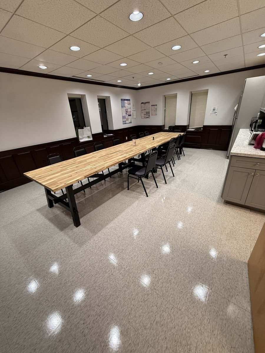 Conference room floor waxed and burnished to a mirror shine in Massachusetts
