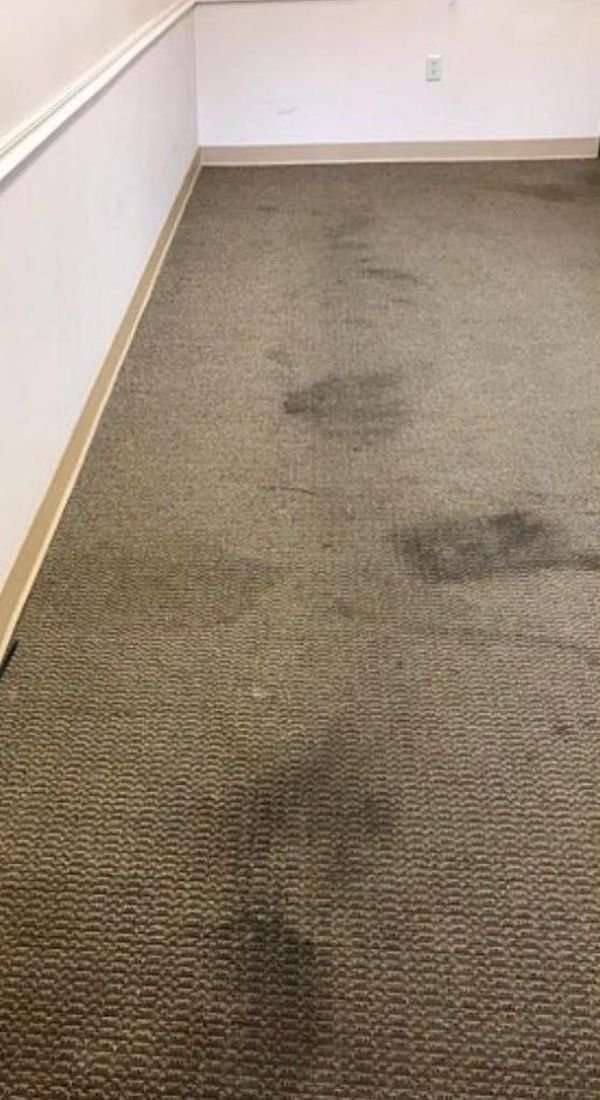 Office carpet with traffic stains before cleaning